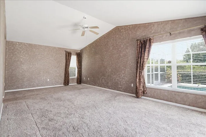 Primary bedroom accommodates large suite of furnishings