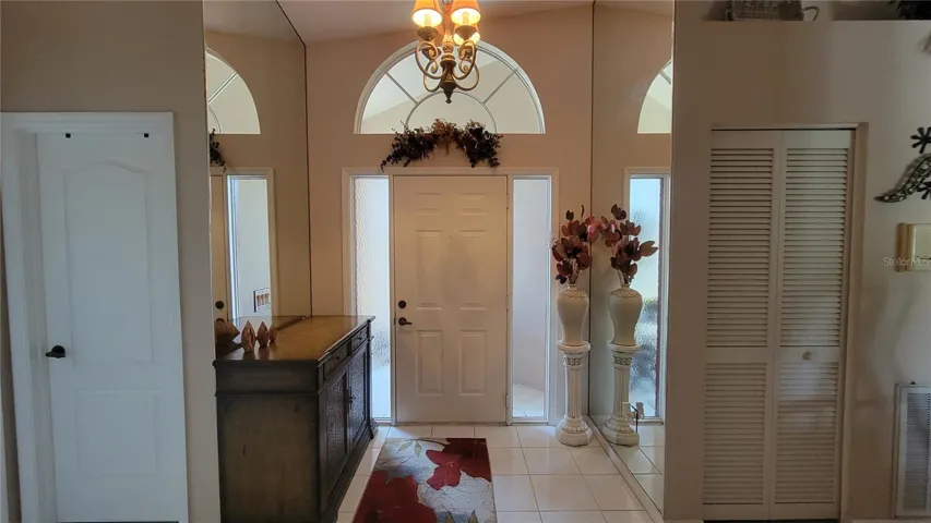 Formal foyer enters to open living and dining areas