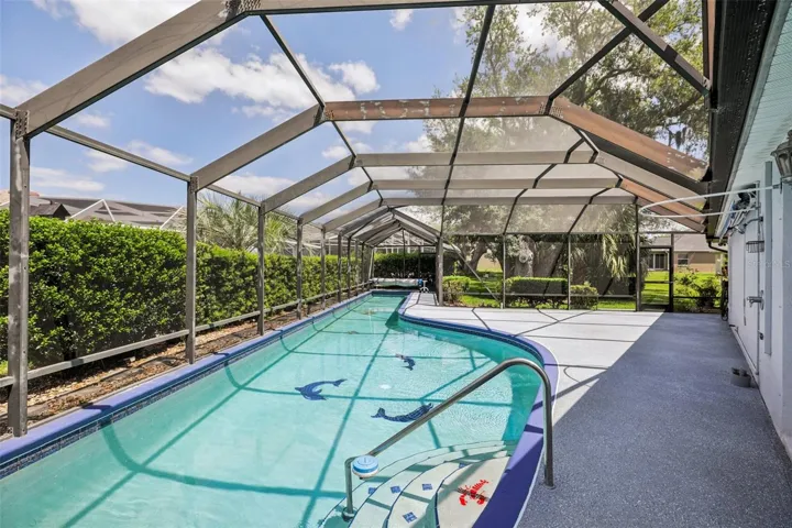 Step outside to a true backyard retreat – the massive SCREENED LANAI is the perfect place to relax or entertain and a second screened area on the side is where you will find your 68’ HEATED LAP POOL – ideal for both exercise or just taking a dip!
