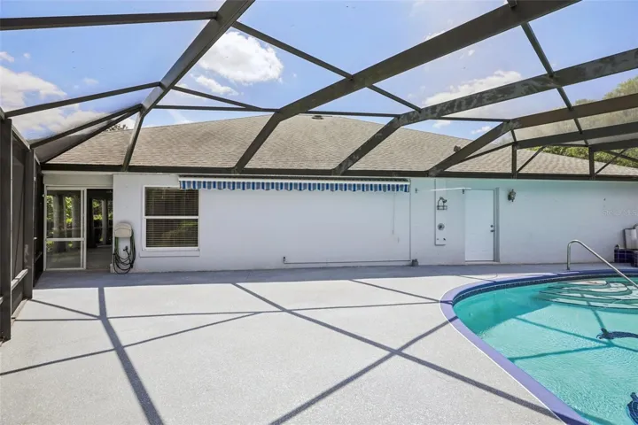 Additional patio space next to the pool.