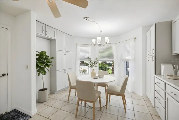 Casual dining in front of a bay window. Virtually Staged.
