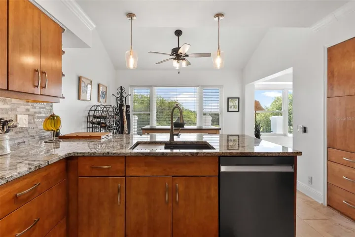 Kitchen opens to breakfast area...