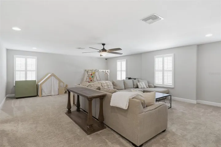Upstairs flex space perfect for a TV room, game room, or additional entertainment area.