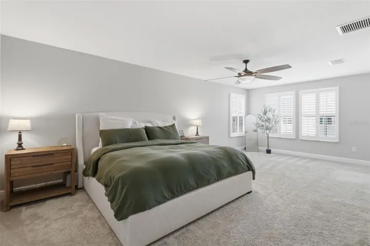 Spacious primary bedroom with bonus flex space ideal for an office or sitting area.