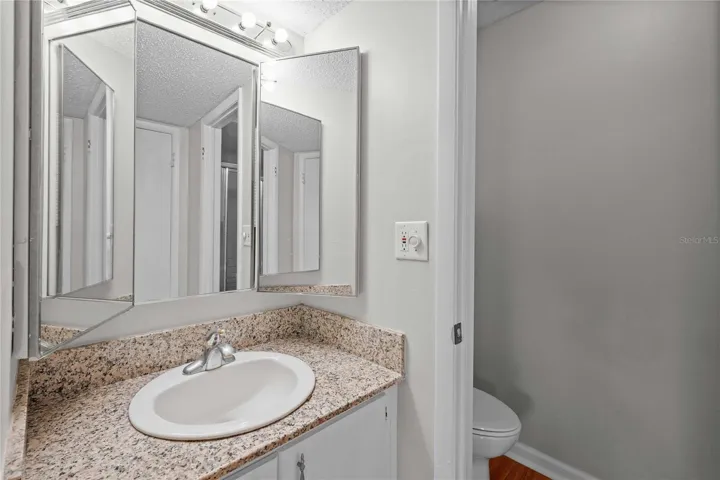 Ensuite, with separate shower, toilet and linen closet.