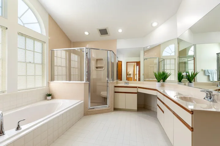 Double sinks, garden tub and separate shower in primary bath.