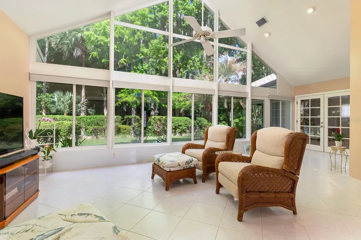 Vaulted ceilings with open view to private backyard.
