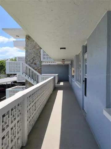 Exterior walkway with convenient staircase.