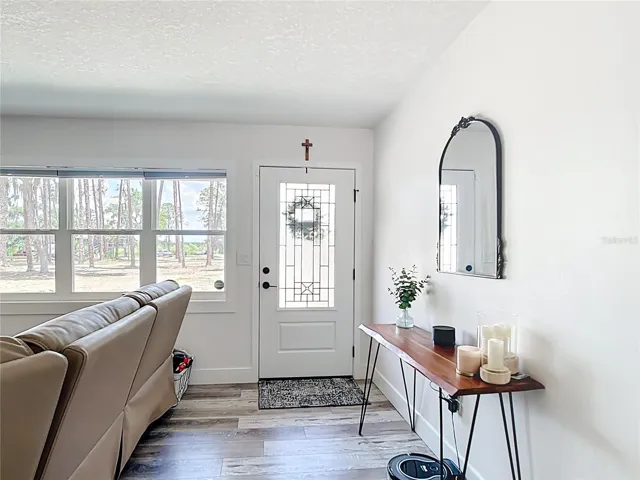 Entry into home showing new front door and windows