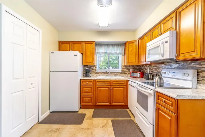 Kitchen with Granite Counters & Tile Backsplash