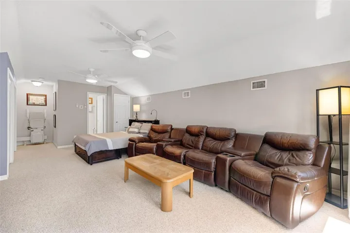 Oversized Upstairs Bonus Room with 2 lighted ceiling fans
