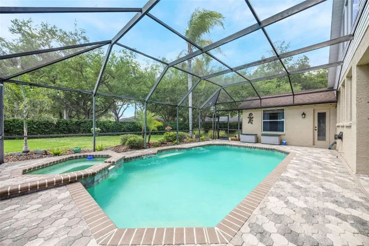 A gorgeous and very private backdrop beyond the screened-in area.