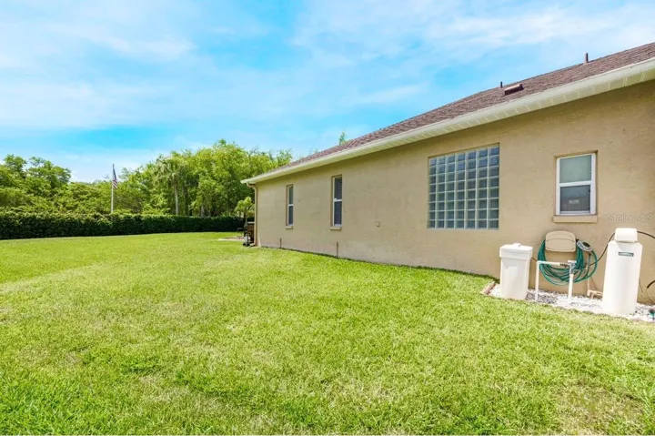 The extremely spacious backyard!  Here you can see the water softener equipment.