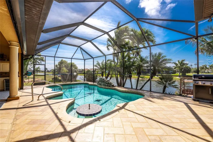 This heated SALTWATER pool has a built in table and bench seat, along with umbrella!