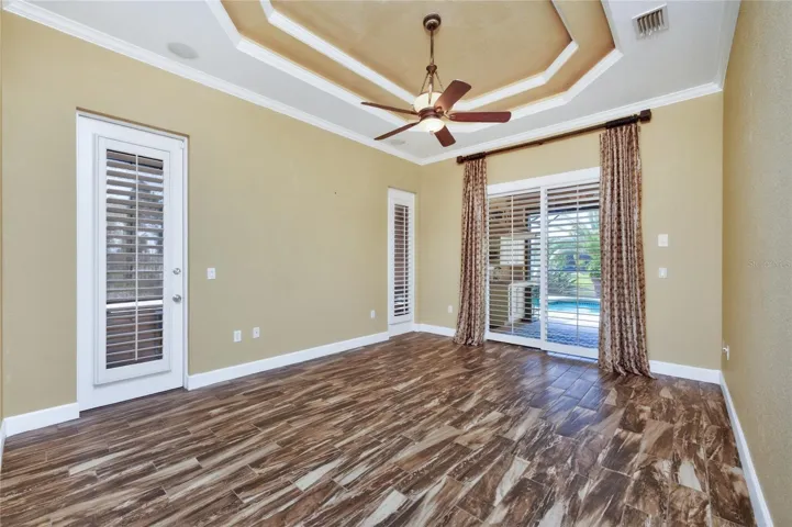 Primary bedroom  - double tray ceiling with crown moulding is a great accent