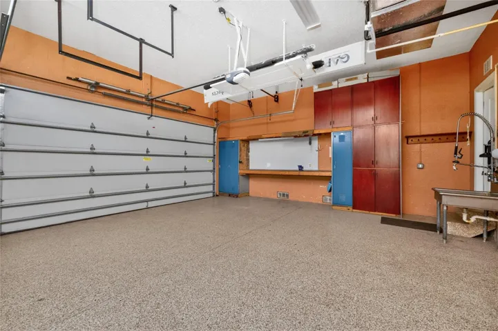 Acrylic coated floor makes for easy cleanup in the oversized two car garage.