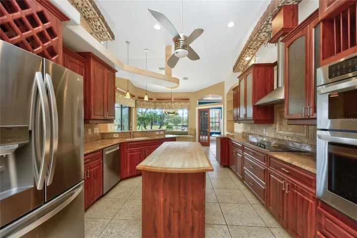 Center island has a butcher block counter top!