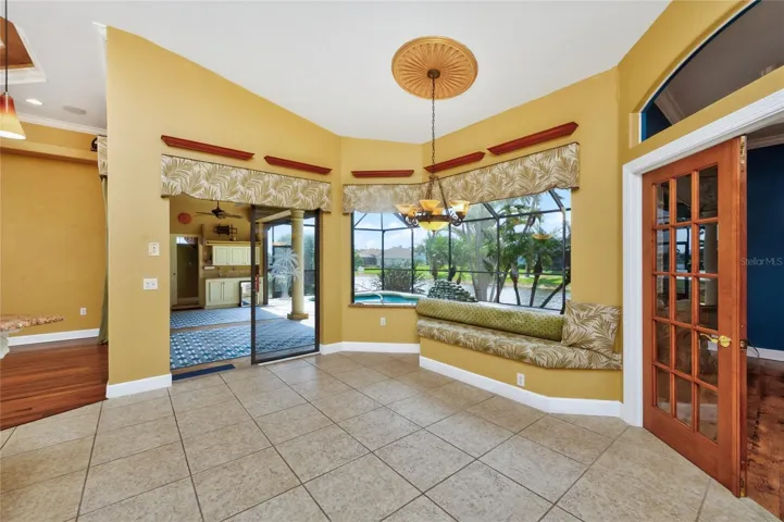 Aquarium window and sliding glass doors to the lanai, make this area so light and bright!