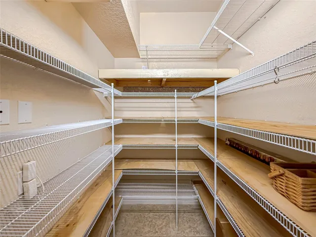 Walk in storage closet off the laundry room