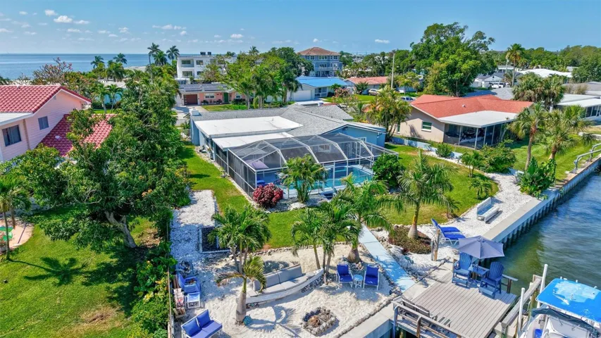 Enjoy the rare luxury of true waterfront living with your own private beach just steps from your door.