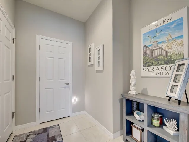 Landing area and coat closet and garage entrance