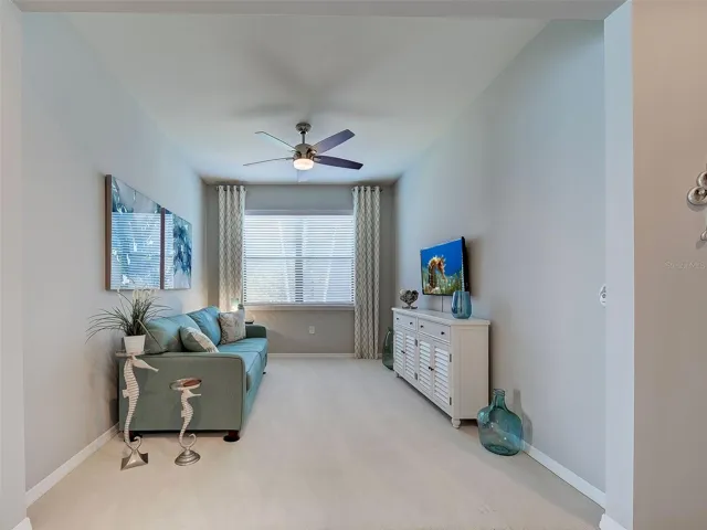 Bonus Room with ceiling fan, new carpet and custom paint