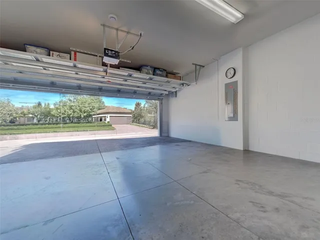 Garage with storage bins mounted on ceiling for extra storage