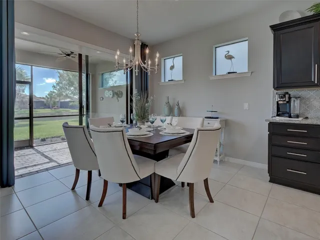 Dining area with slider to lanai that has plumbing available