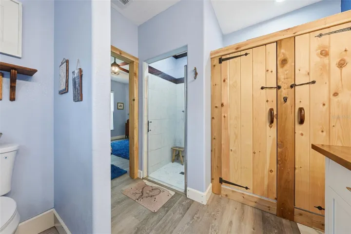 Primary bath with custom cedar closet, vanity and walk in shower