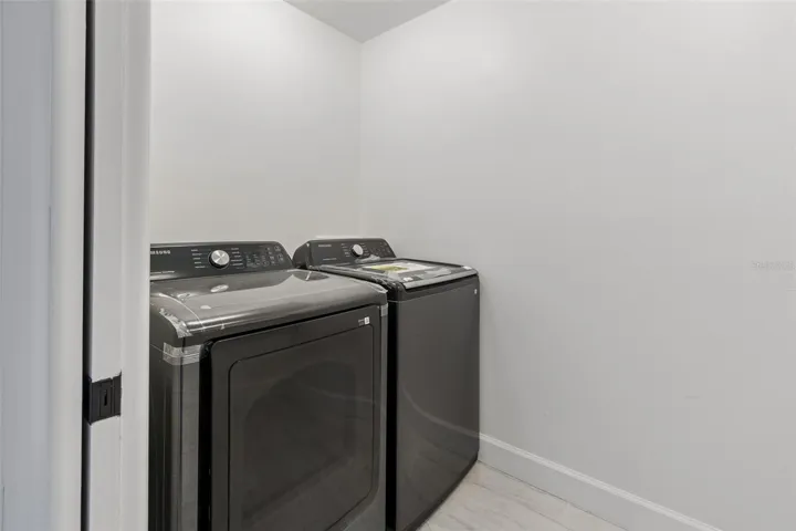 Laundry room With Brand New Washer & Dryer