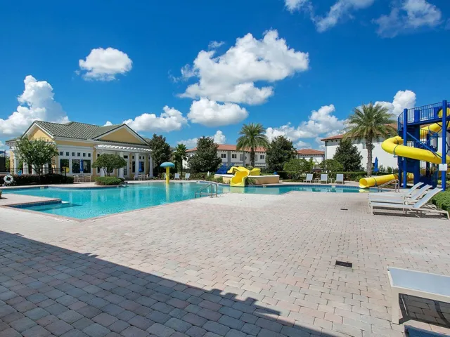 Resort style community pool with clubhouse and water features.