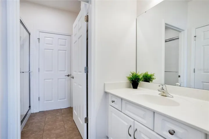 Bathroom with extended vanity and clean finishes.