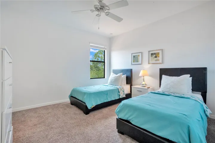 Twin bedroom setup ideal for guests or rental use.