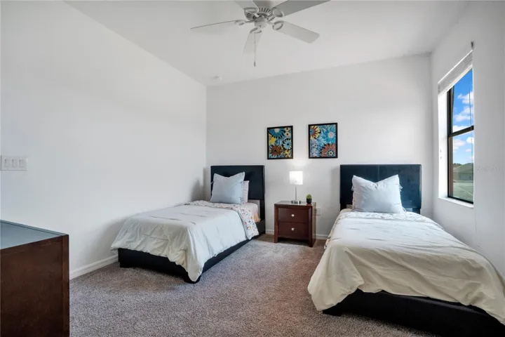 Twin bedroom maximizing guest capacity for rental potential.