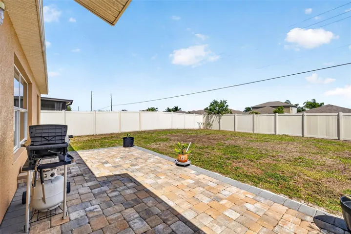 Pavered patio with fully fenced back yard. No back yard neighbors.