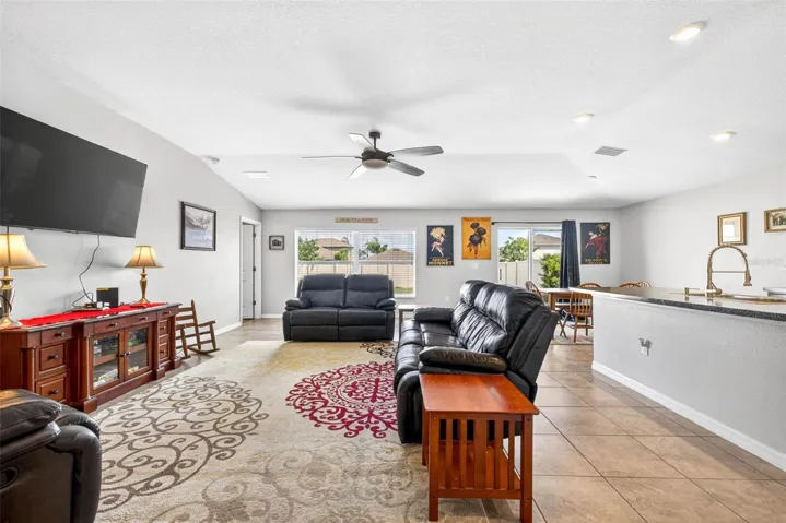 Open floor plan features living/dining/kitchen combination complete with ceiling fan