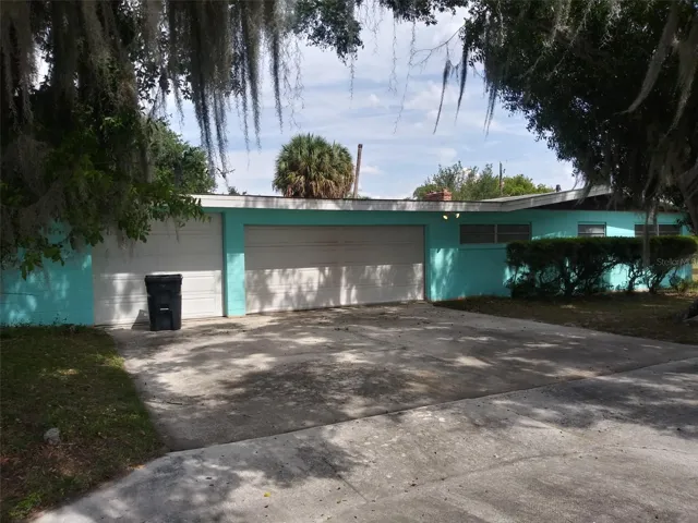 3 doors on the garage/ carport