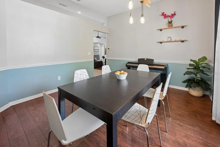 Formal dining room leading to kitchen and family room