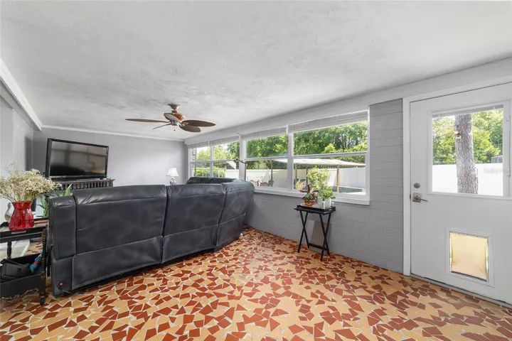 Family Room with Broken Mosaic Tile and Newer Windows