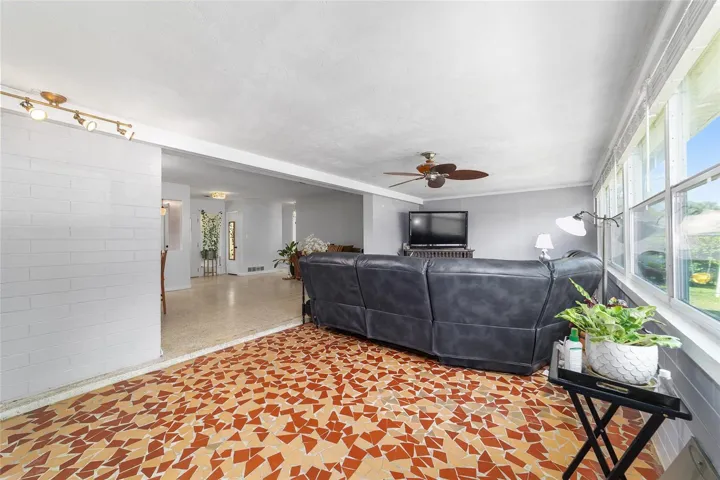 Family Room with Broken Mosaic Tile and Newer Windows