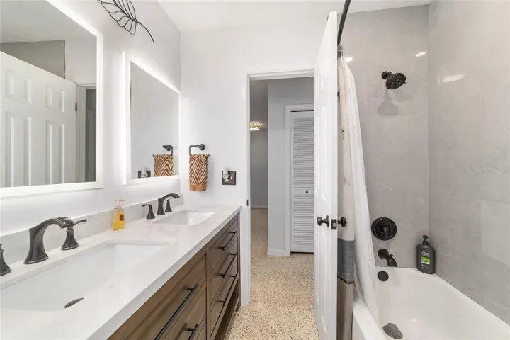 Guest Bathroom with Double Sinks and Tub/Shower Combo
