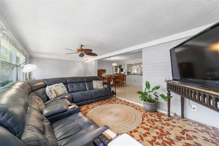 Family Room with Broken Mosaic Tile and Newer Windows