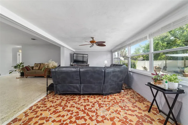 Family Room with Broken Mosaic Tile and Newer Windows