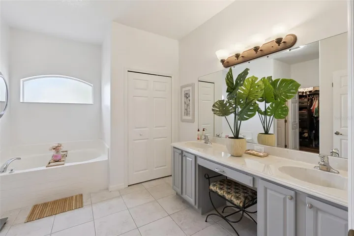 Primary Bathroom with Dual Sinks & Linen Closet