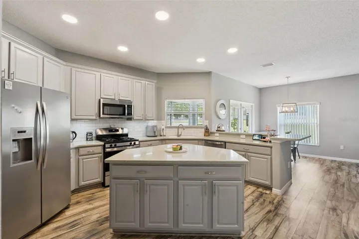 Kitchen features 42" Upper Cabinetry with Crown Molding, Undermount Task Lighting, Brush Nickel Hardware