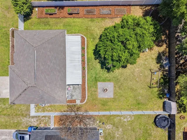 Aerial Photo of the backyard showcasing a gardeners dream with five garden beds.