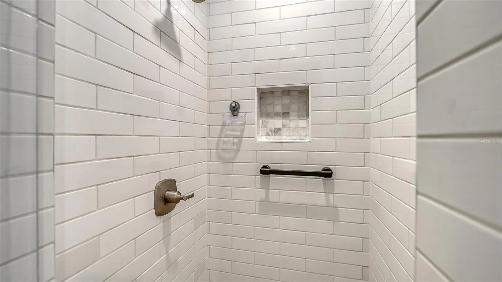 Guest bathroom tiled shower.