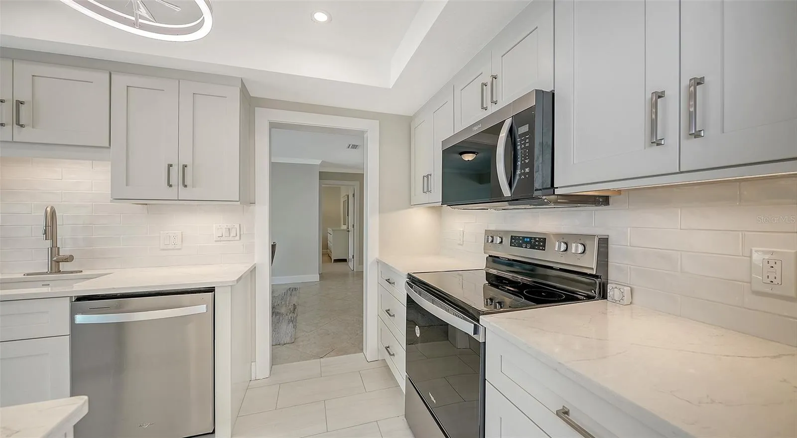 Granite counters. The view leading into the dining room.