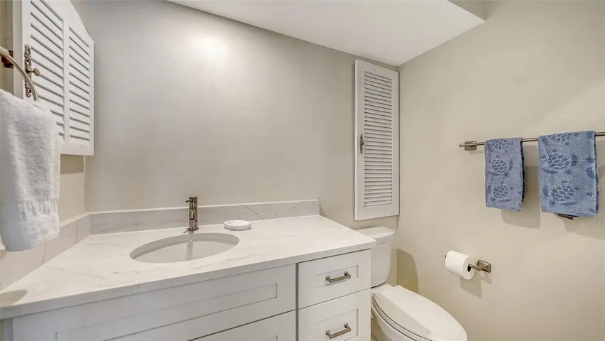 Guest bathroom.  A mirror has now been placed above the sink.