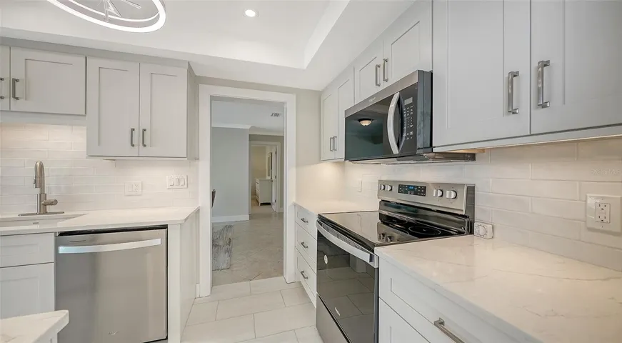 Granite counters. The view leading into the dining room.